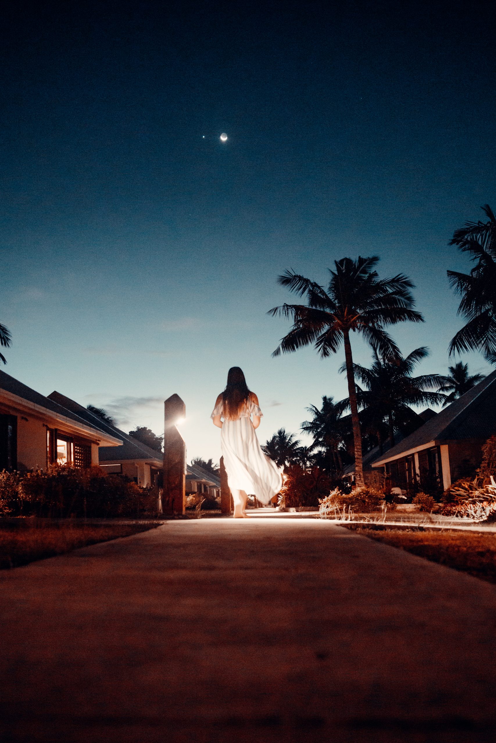 20180716-4K-Canon4766 girl walking away in white dress after sundown in island resort in fiji