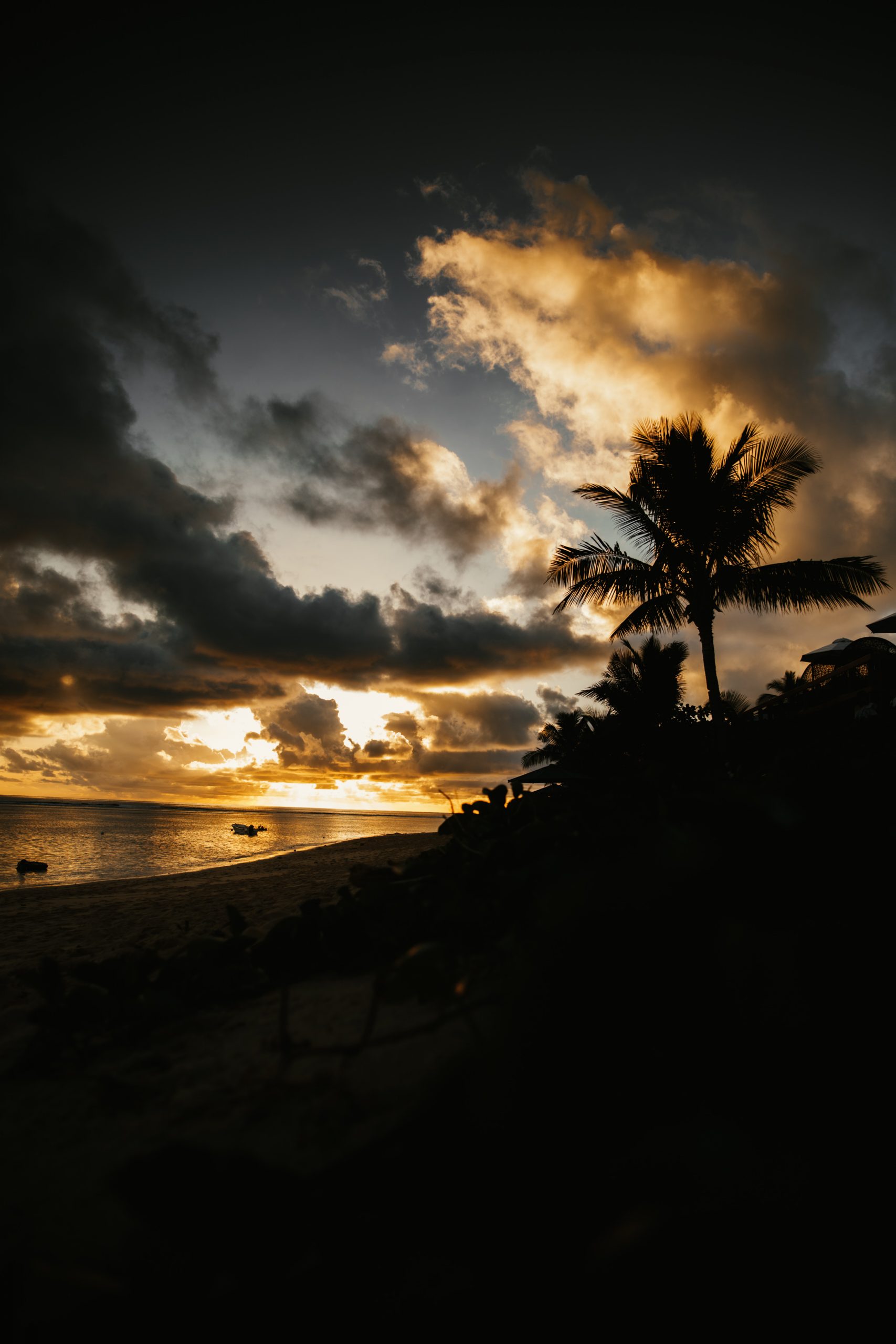 sunset over reef while on an island getaway in fiji