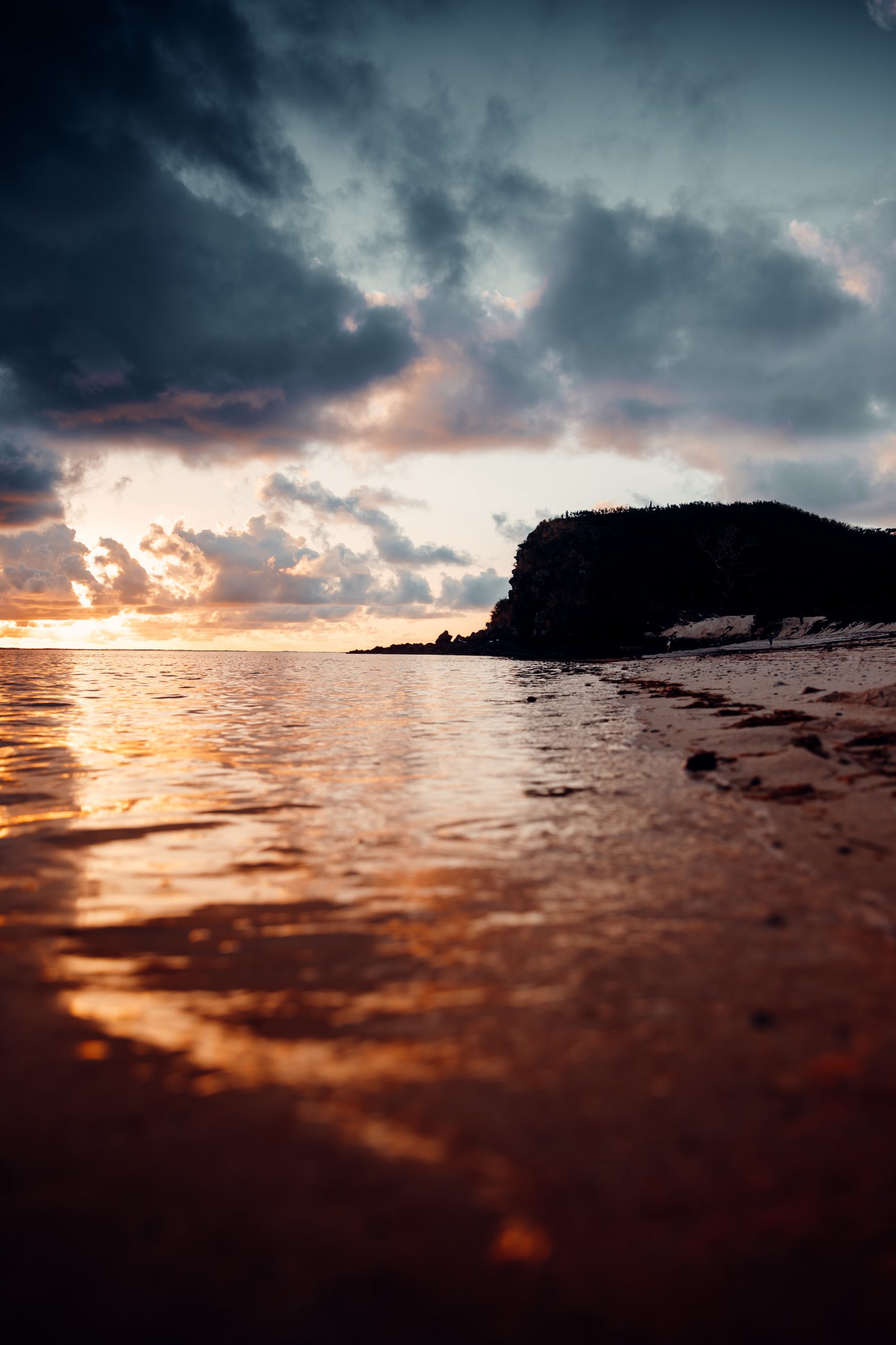 sunset over reef while on an island getaway in fiji