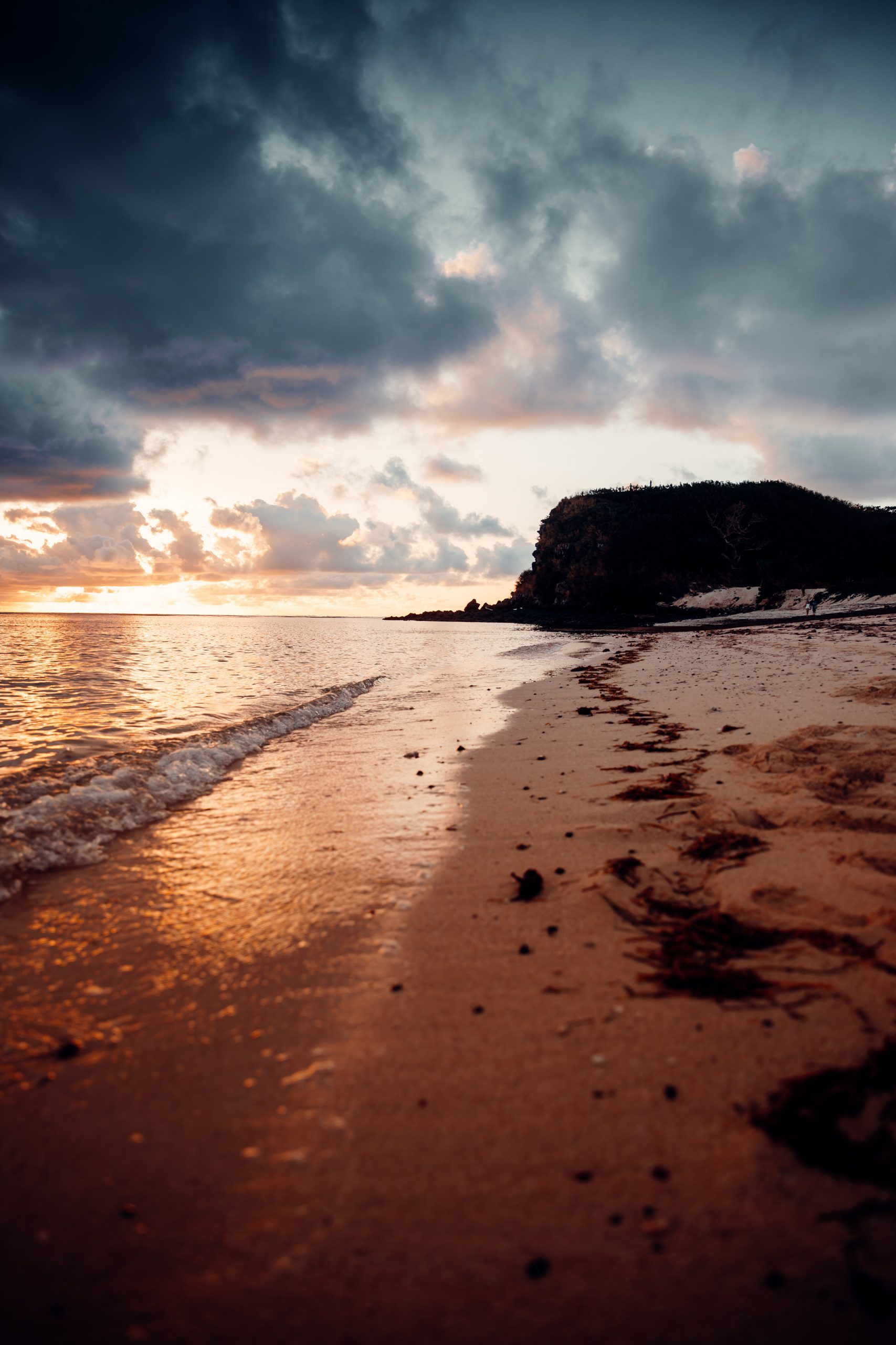 sunset over reef while on an island getaway in fiji