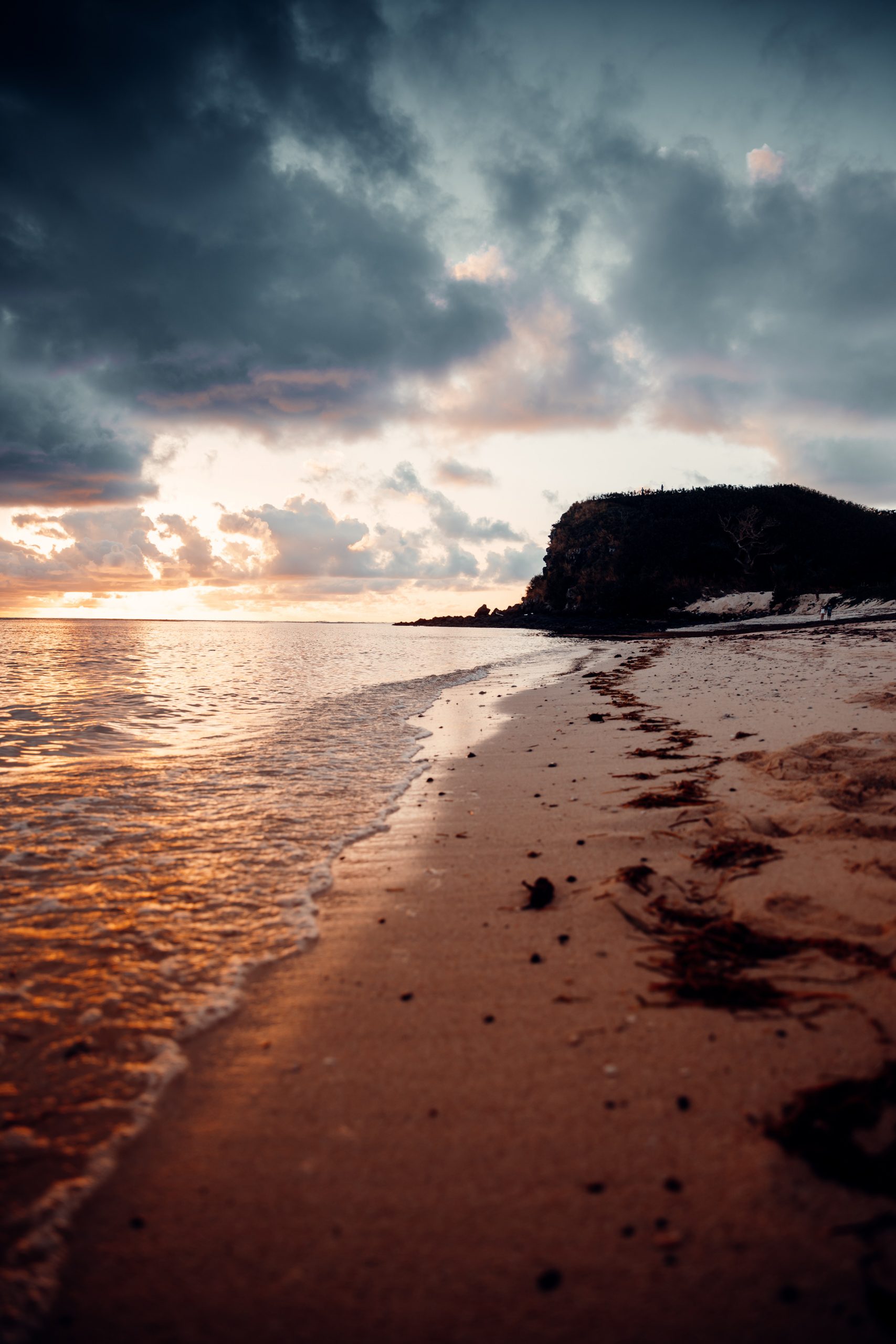 sunset over reef while on an island getaway in fiji