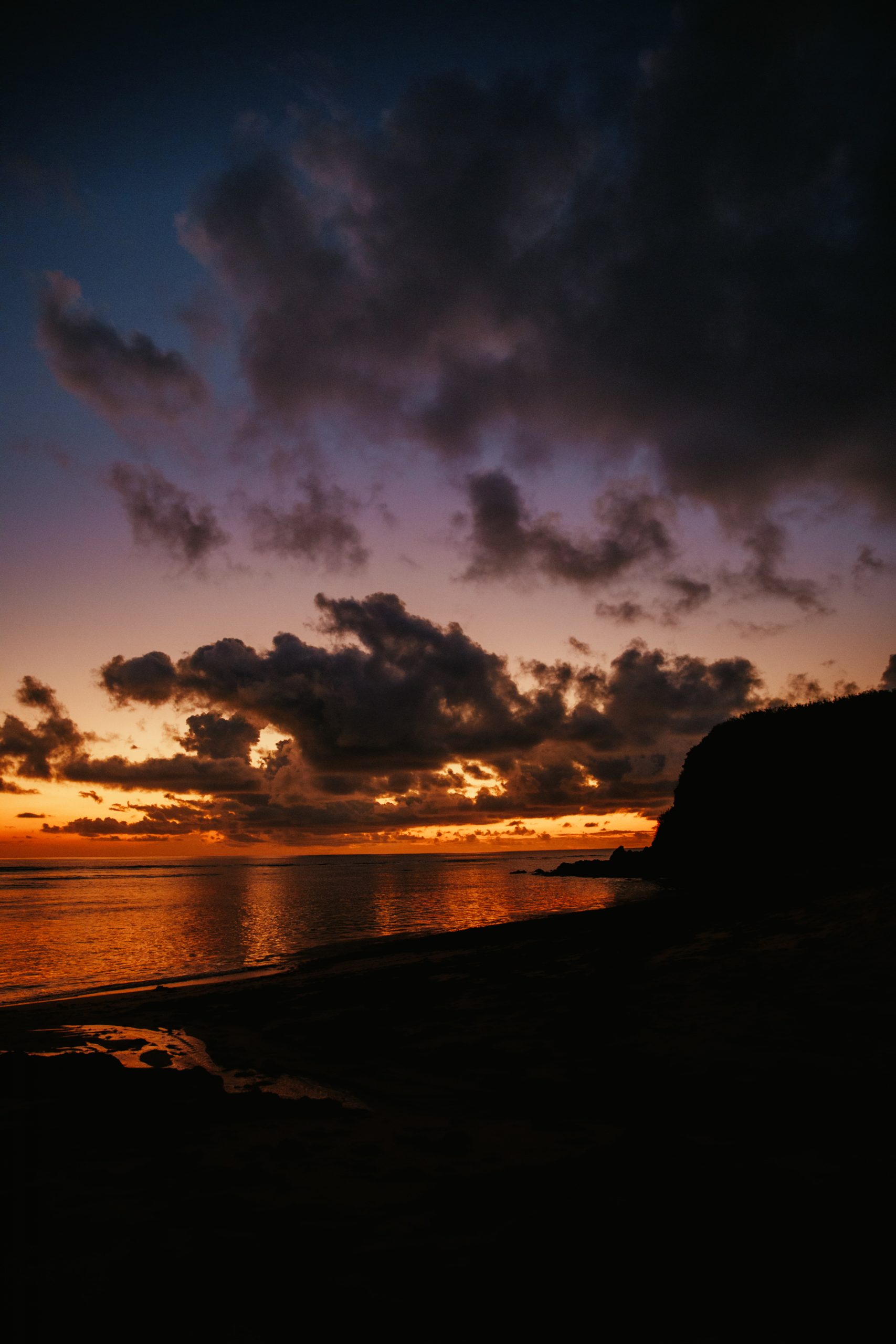 sunset over reef while on an island getaway in fiji