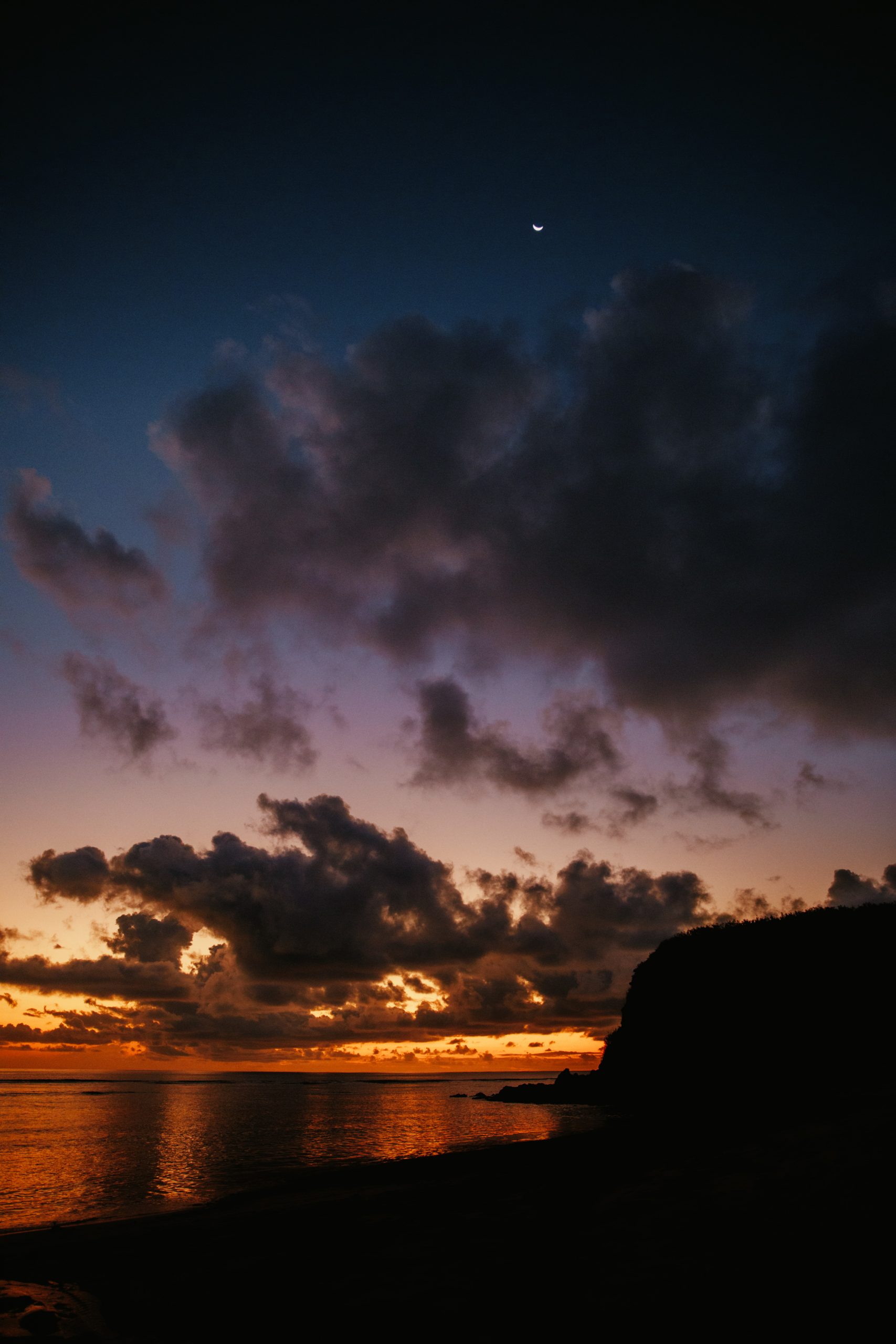 sunset over reef while on an island getaway in fiji