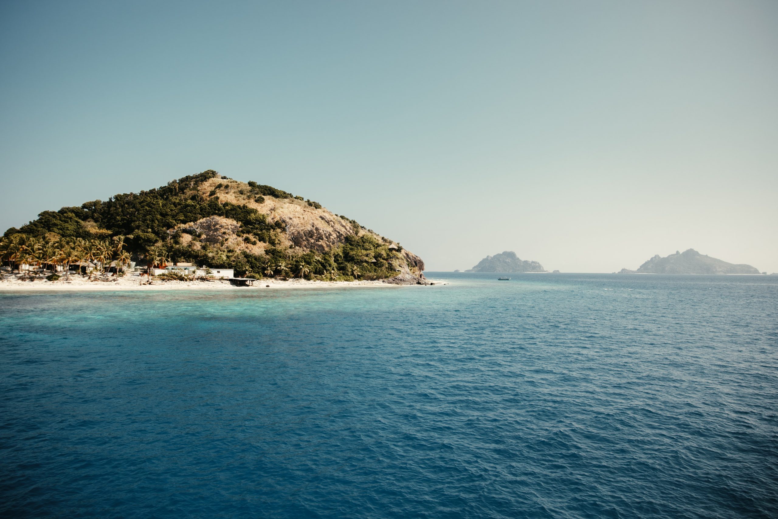 fiji islands, blue ocean water and surrounding reef