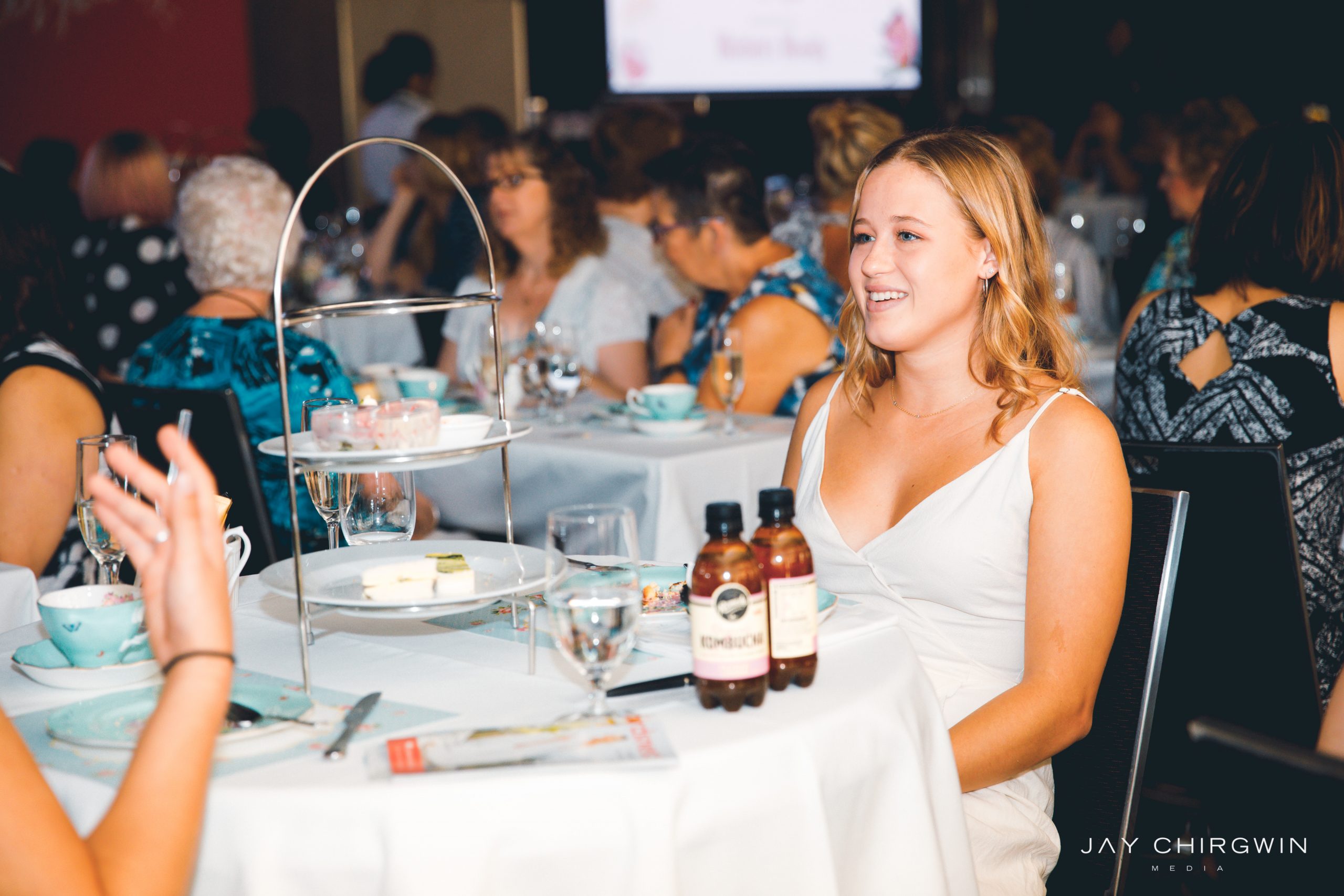 girl smiling at high tea party