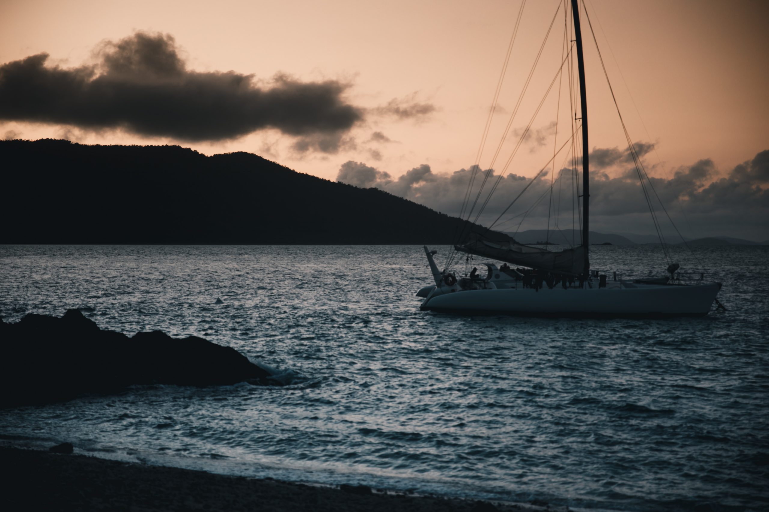 Sail boat during a sunset at daydream island (Whitsunday Islands, Queensland Australia)