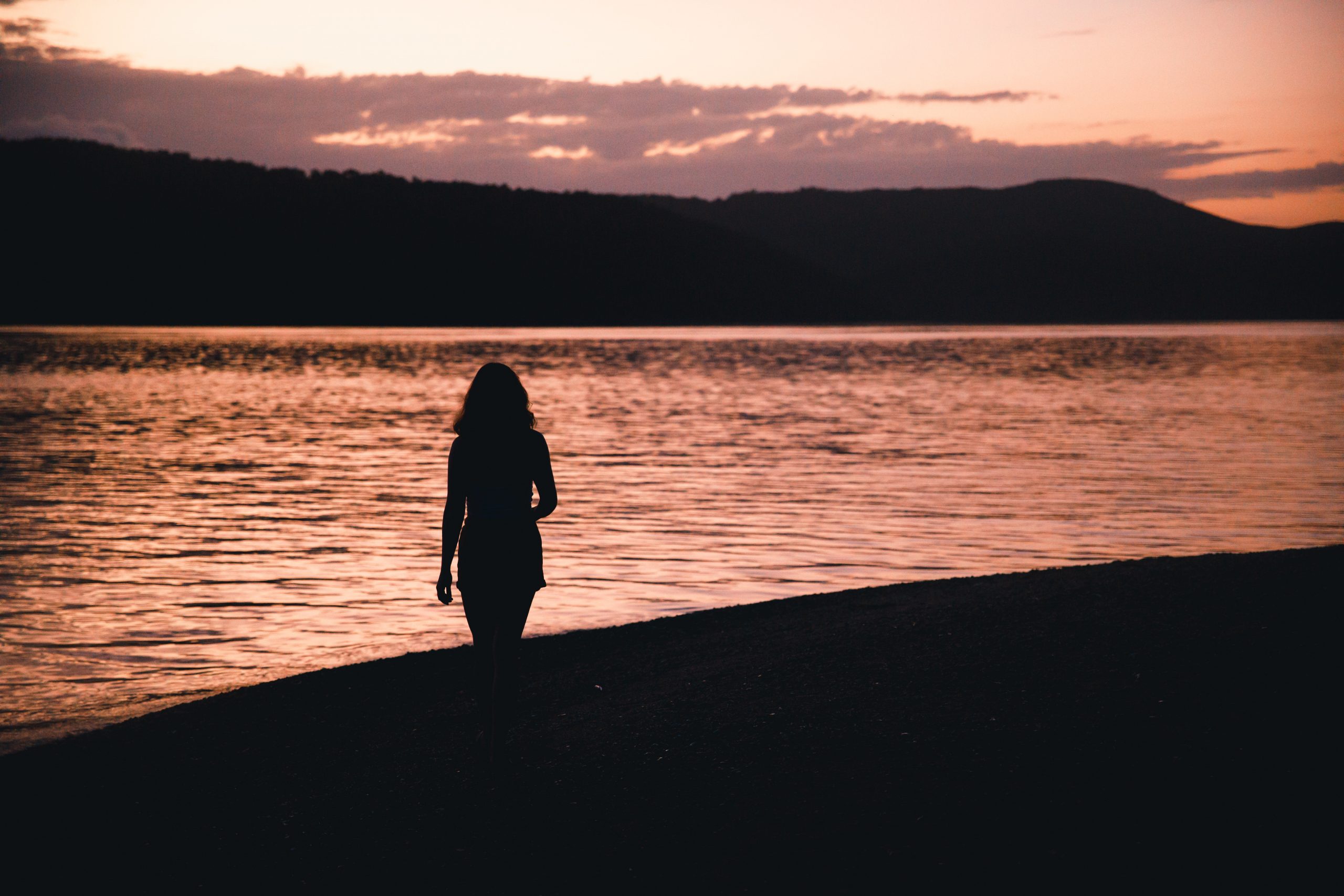 girl in front of sunrise on daydream island in the whitsunday islands (Hamilton island) Queensland Australia